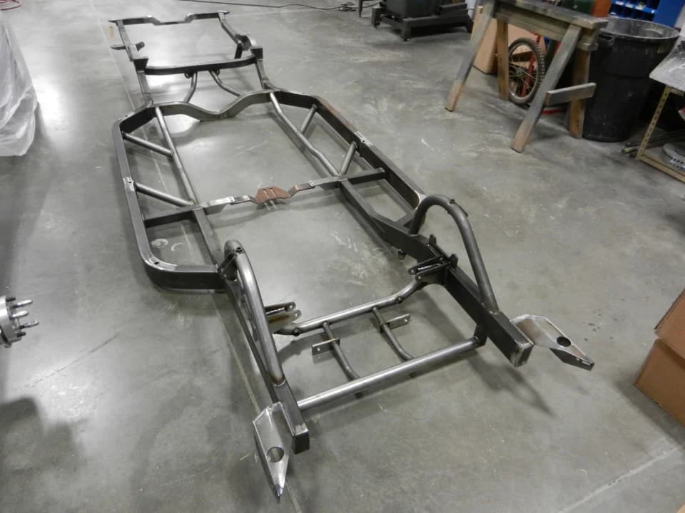 Custom metal automotive chassis frame for transportation industry applications, precision-engineered for durability and performance.