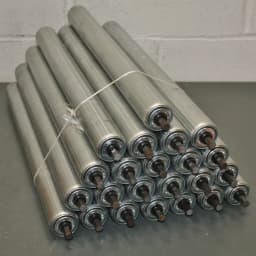 Heavy-duty metal conveyor rollers for material handling and industrial automation in manufacturing and logistics sectors.