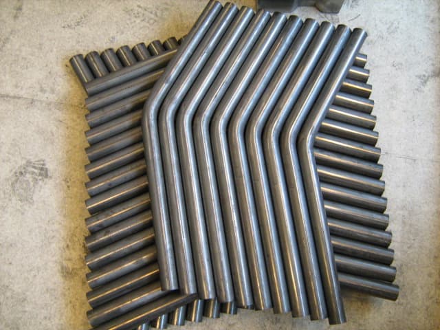 CNC-bent pipes for boiler and chemical plant applications.