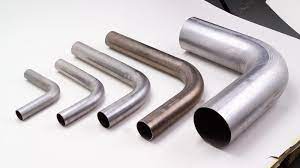 Short metal pipe bends with different diameters.