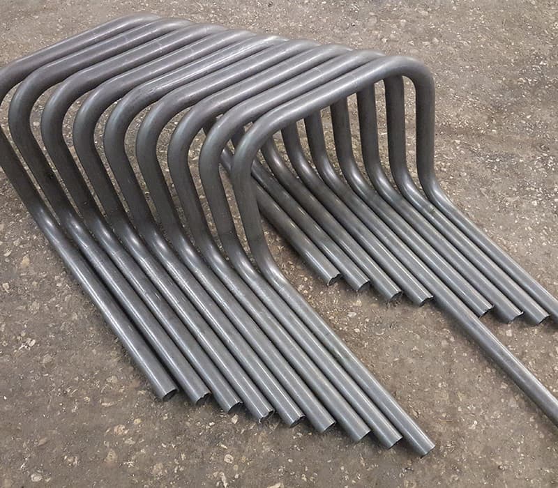 CNC-formed U-shaped metal bends for chairs and furniture applications.