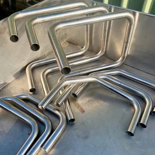 Angular rectangular stainless steel bends crafted with CNC precision for trolleys.