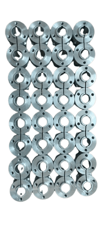 Precision-machined aluminum wheel hubs stacked in a grid, showcasing industrial component quality.