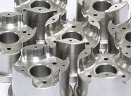CNC-machined metal components with complex profiles and smooth surface finish.