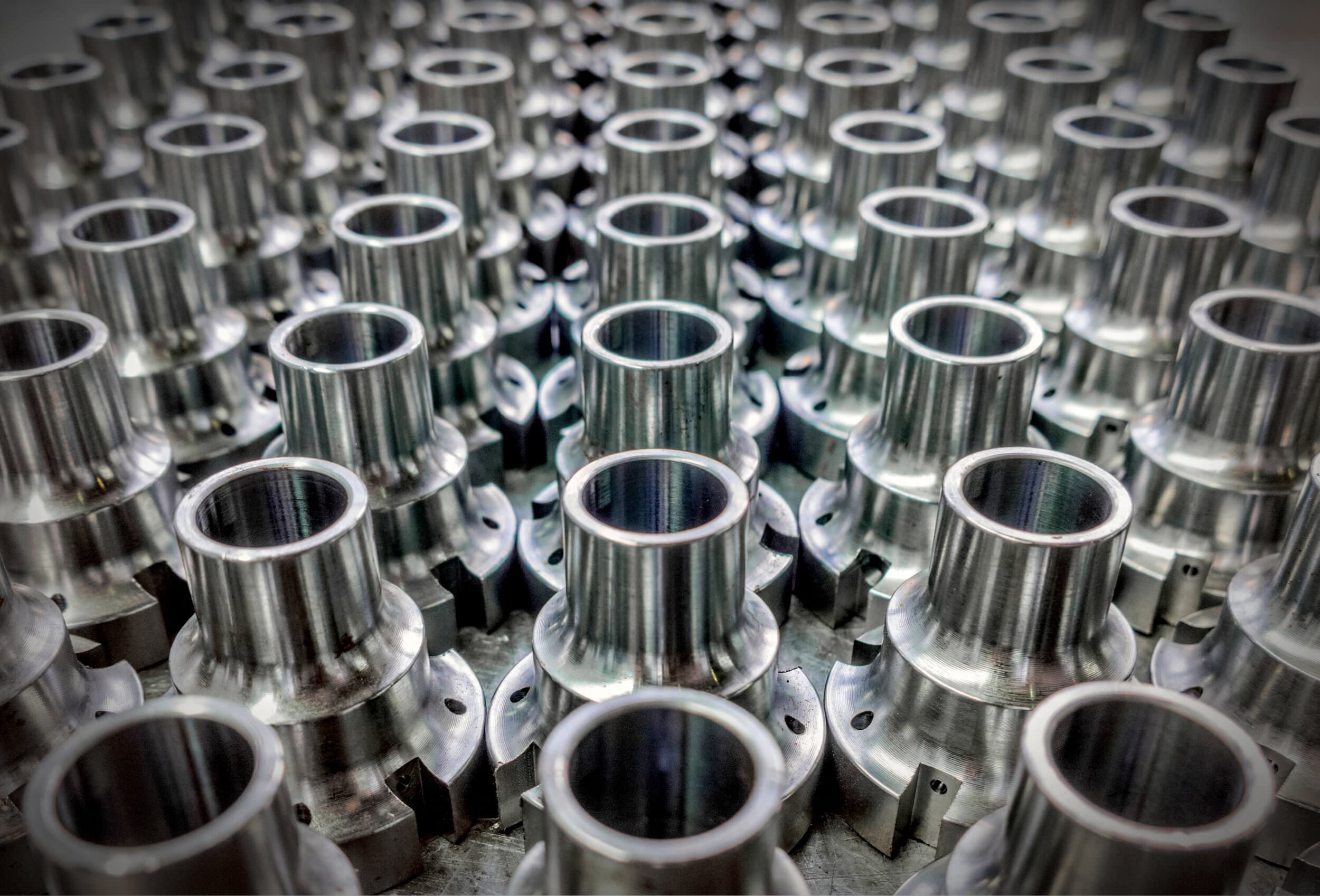 High-volume production of precision-turned metal parts for industrial use.
