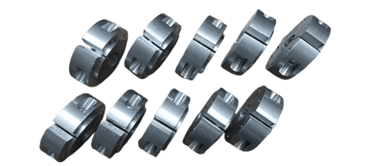 Precision-machined aluminum brake hubs arranged in rows, designed for lightweight industrial or automotive applications.