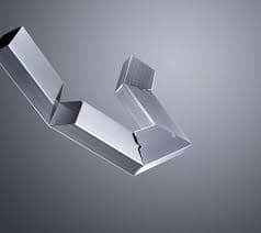 Single metal tube cut and bent into angled segments to form a designer geometric shape.