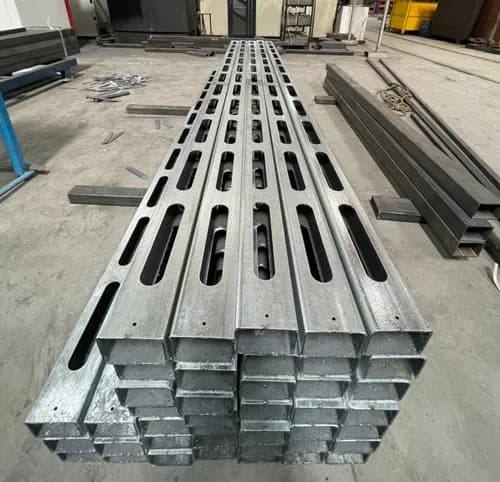 Rectangular MS tubes with precision laser-cut slots.
