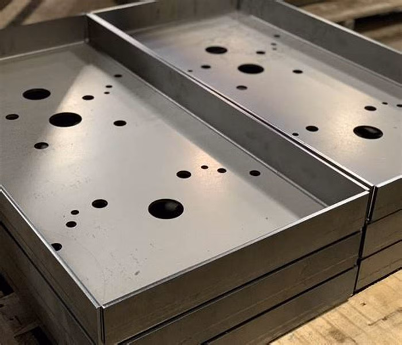 Customized laser-cut sheet metal panel with intricate patterns, showcasing precision fabrication for architectural use.
